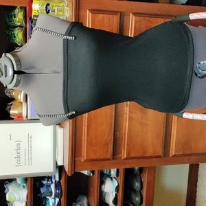 Black tank top with rhinestone straps. Rayon poly blend with straight neckline